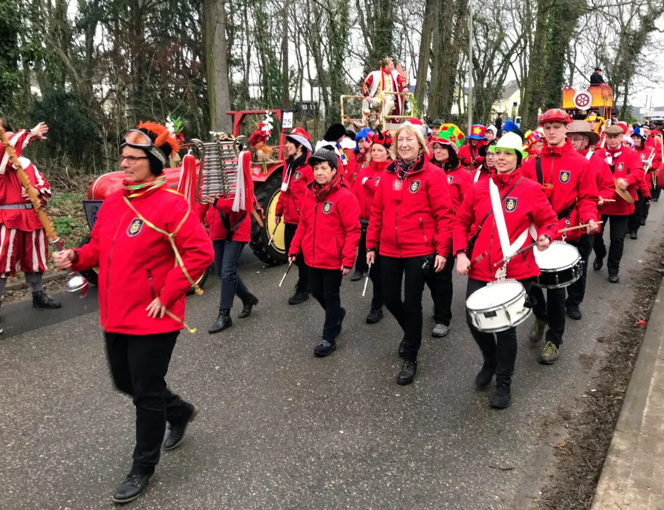 People participating in a coordinated community parade, illustrating the planning and teamwork behind successful training workshops.