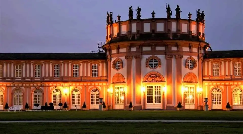 Illuminated symmetrical building facade representing structure and consistency in quality assurance