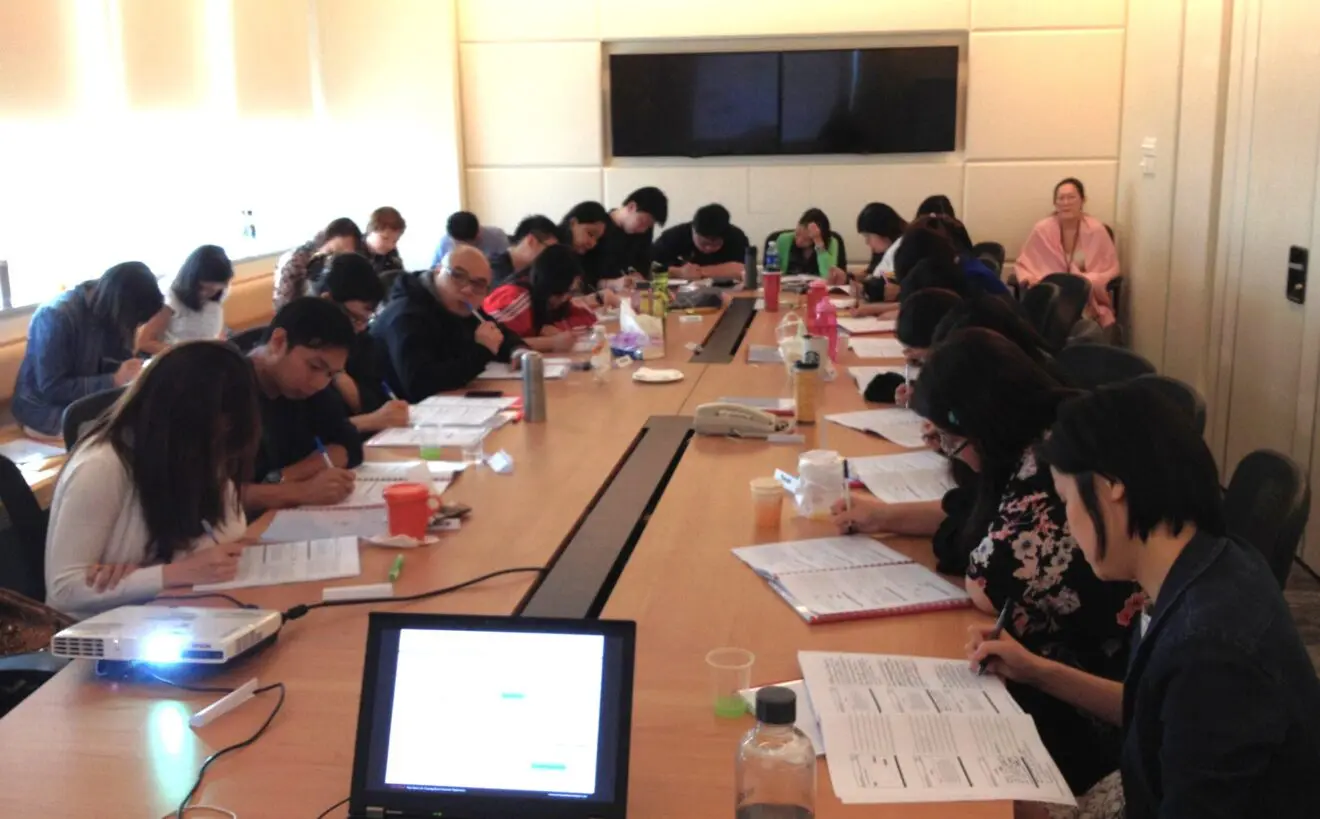 Participants completing a Customer email writing exercise during an OmniTouch training class